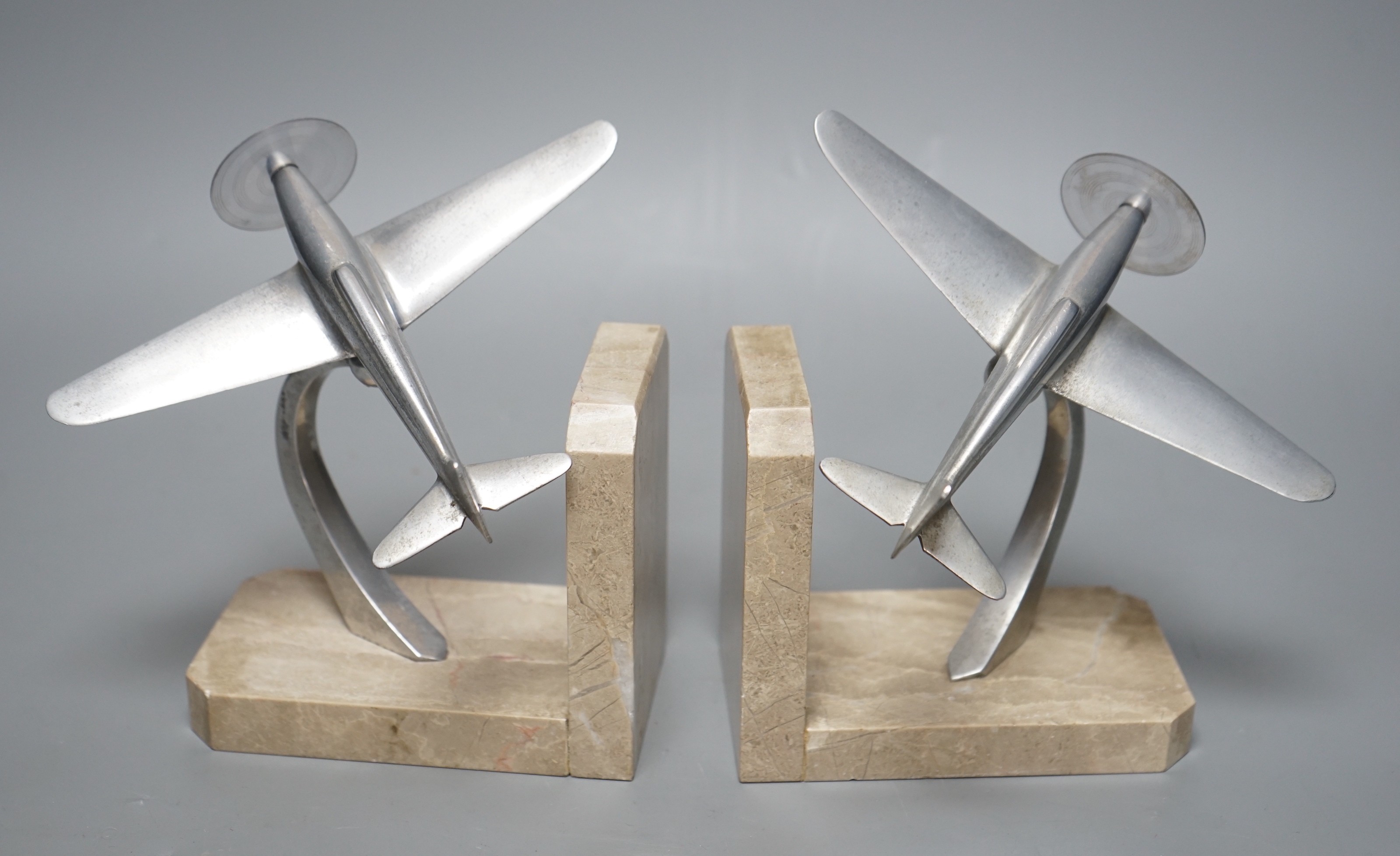 A pair of Art Deco chrome plated and marble aircraft book-ends, 17cm